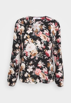 Black floral blouse featuring long sleeves, a V-neckline, and a variety of large multi-colored flowers including pink, white, and brown accents.