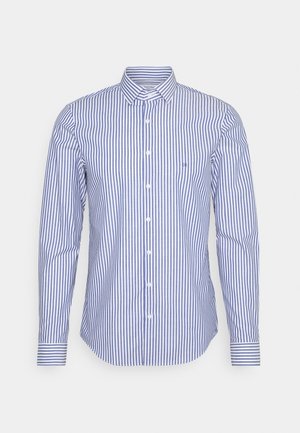 Men's long-sleeve button-up shirt with blue and white vertical stripes and a pointed collar on a white background.
