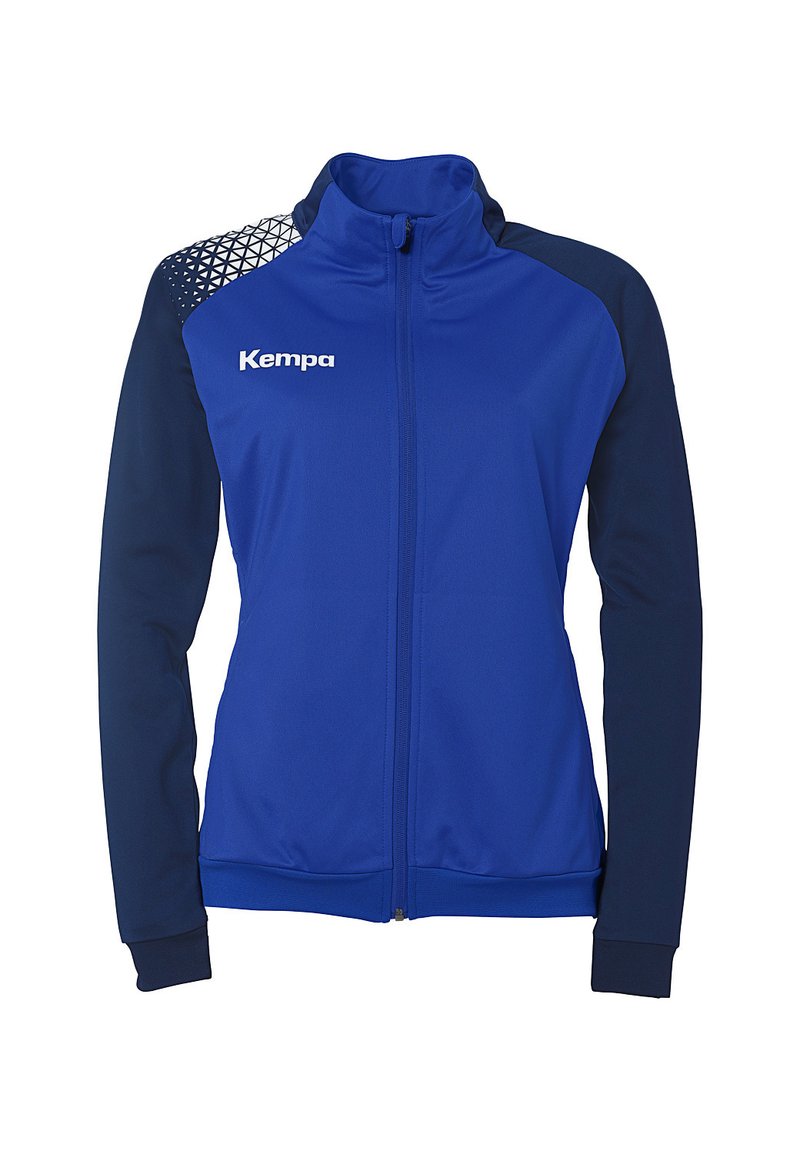 Blaue Sportjacke mit navyfarbenen Ärmeln, hohem Kragen und Reißverschluss. Mit geometrischem Muster auf der Schulter. Kempa-Logo auf der Vorderseite. Weicher Stoff.