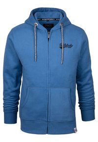 Blaues Zip-Hoodie aus Mischgewebe. Verfügt über eine Fronttasche, gerippte Bündchen und karierten Kordelzug. Schwarzes Logo auf der Brust.