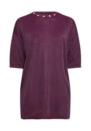 Lyhythihaisia, löysästä kankaan syvän purppuranvärisestä kankaasta valmistettua toppia, jossa on pyöreä kaula-aukko ja koristeelliset vaaleat helmet kauluksessa.