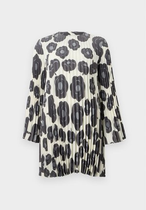 Pleated tunic in cream with large black floral pattern. Features bell sleeves and gathered hem. Lightweight fabric with smooth texture.
