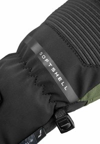Black softshell glove with a textured upper, green accent, and a side buckle. Features prominent "SOFT SHELL" label on the cuff.