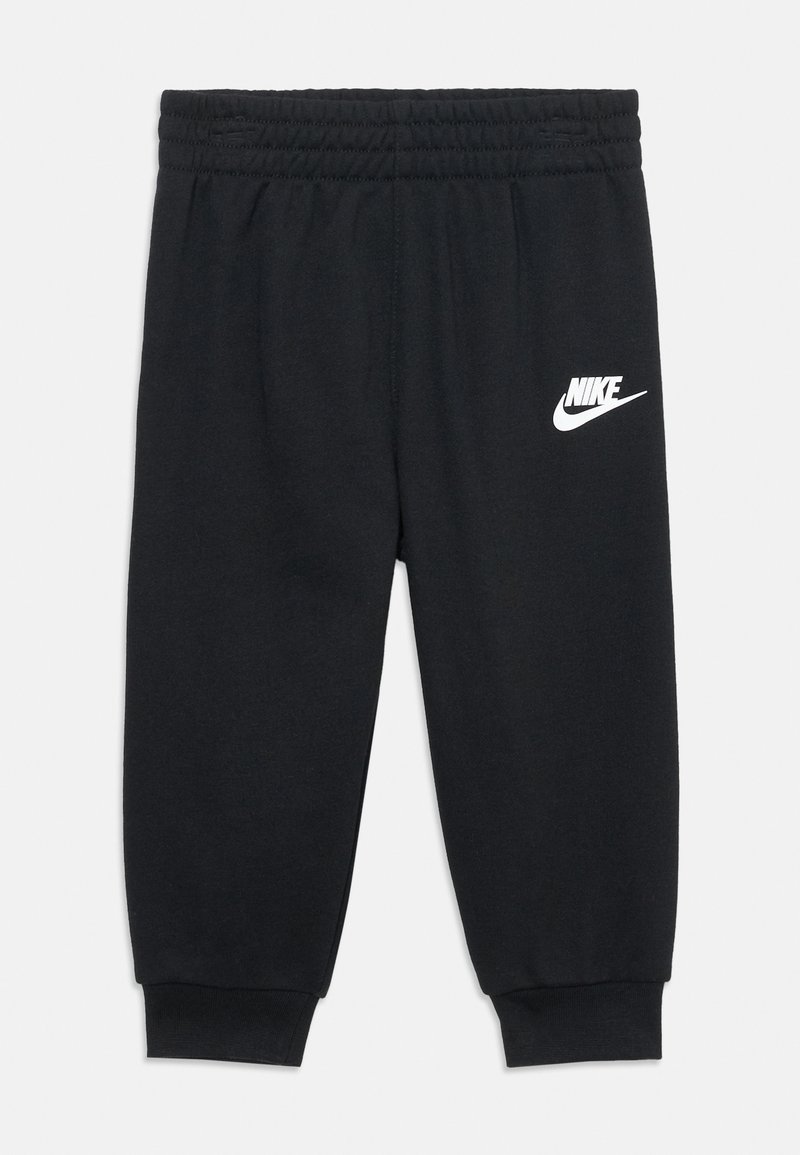 Pantalon de survêtement noir en mélange de coton avec une taille élastique et des poignets. Présente un logo Nike blanc sur le côté gauche.