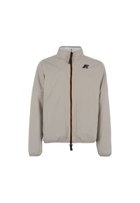 Jasno beżowa kurtka zapinana na zamek z wysokim kołnierzem, elastycznymi mankietami, dwoma przednimi kieszeniami oraz małym czarnym logo po lewej stronie klatki piersiowej.