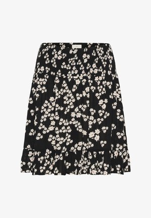 Jupe noire à motifs floraux avec taille smockée, ourlet volanté, et un motif floral blanc avec des accents rouges.