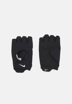 Zwarte vingerloze handschoenen van rekbaar materiaal, met een open palmontwerp, gripaccenten en het Nike-logo in het wit.