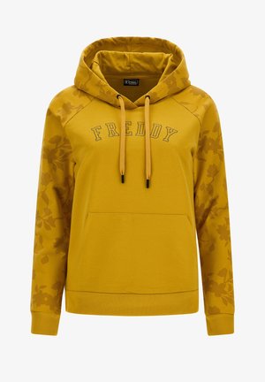 Sweat à capuche jaune avec une poche avant, présentant un motif floral sur les manches et le mot "FREDDY" brodé en lettres foncées. Cordon de serrage ajustable.