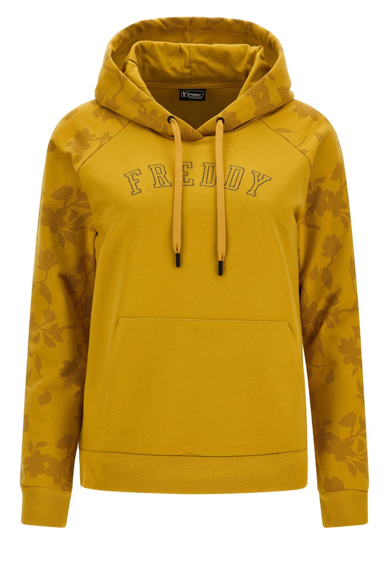 Sweat à capuche jaune avec une poche avant, présentant un motif floral sur les manches et le mot "FREDDY" brodé en lettres foncées. Cordon de serrage ajustable.