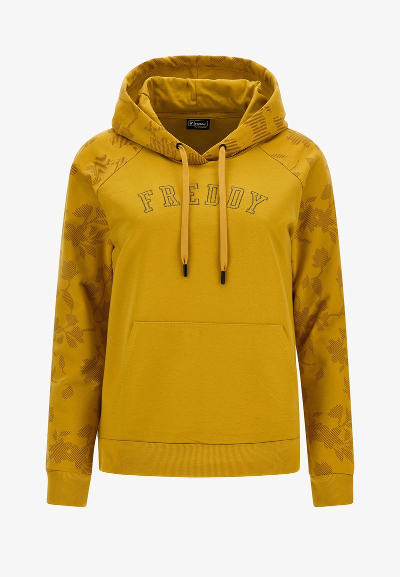 Sweat à capuche jaune avec une poche avant, présentant un motif floral sur les manches et le mot "FREDDY" brodé en lettres foncées. Cordon de serrage ajustable.