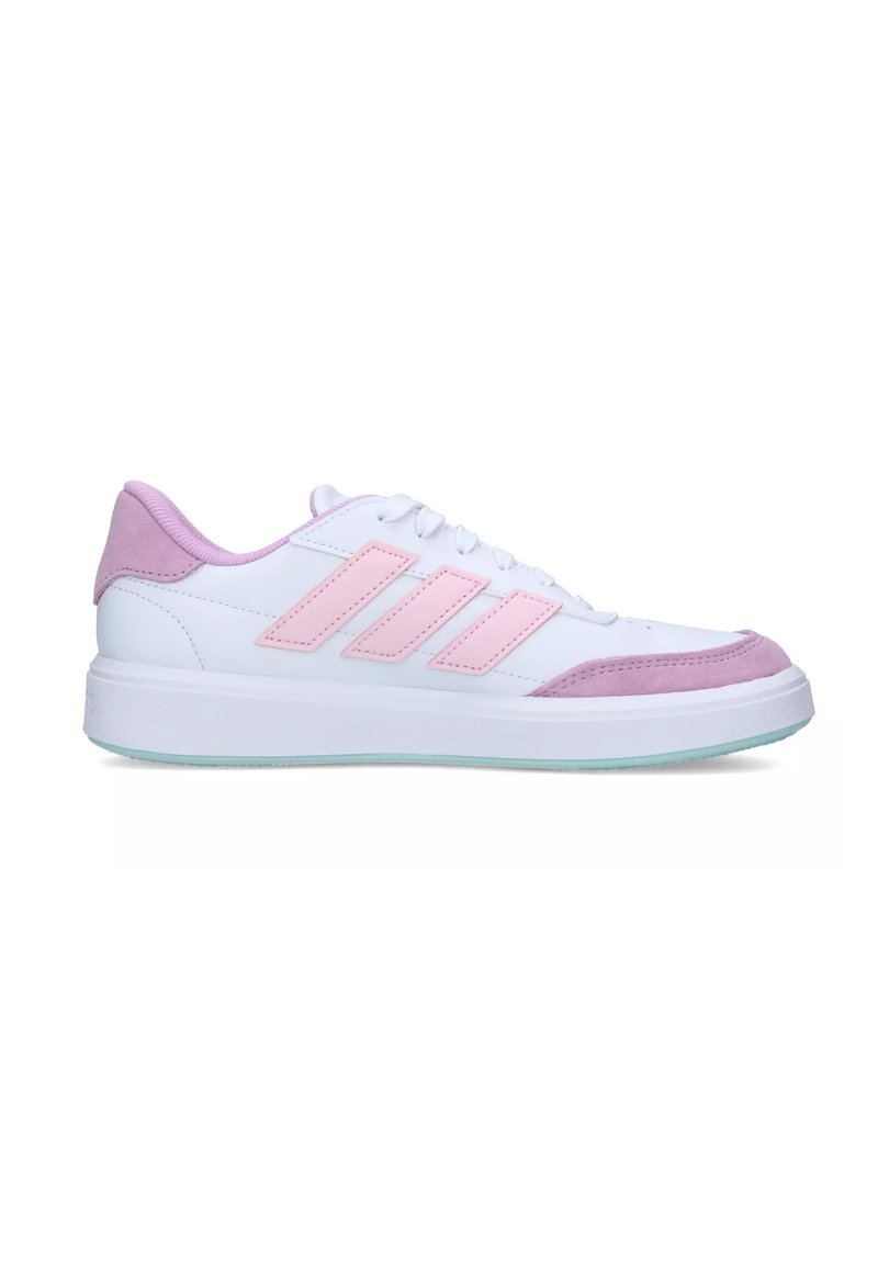 White sneaker with pink suede accents and three pink stripes on the side. Features a smooth texture and a rubber sole with a slight transparency.