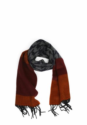 Mehrfarbiger Schal mit einem Hahnentrittmuster in Grau und Schwarz, ergänzt durch bordeauxfarbene und orangefarbene Abschnitte, mit schwarzen Fransen. 