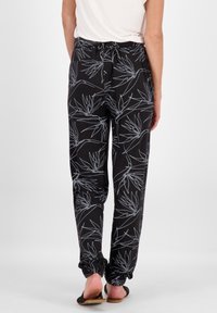 Schwarze Hose mit botanischem Muster in Hellblau. Mit elastischem Taillenbund und gebundenen Bündchen. Leichtes Material, geeignet für den Freizeitlook.