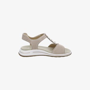 Beige open-toe sandal with a cushioned sole, adjustable ankle strap, and decorative silver buckle on the front strap.