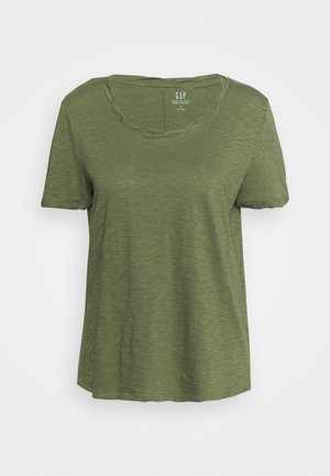 T-shirt en coton vert olive à manches courtes et col rond avec une texture douce en slub de GAP, présenté sur un fond blanc.