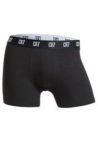 Czarne bawełniane bokserki o dopasowanym kroju. Posiadają biały elastyczny pas z powtarzającym się logo „CR7”. Bez dodatkowych wzorów czy akcentów.