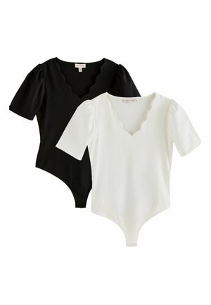 Sort-hvide bodysuits med korte ærmer, takkede V-udskæringer og puffede ærmer, lagt overlappende på en hvid baggrund.
