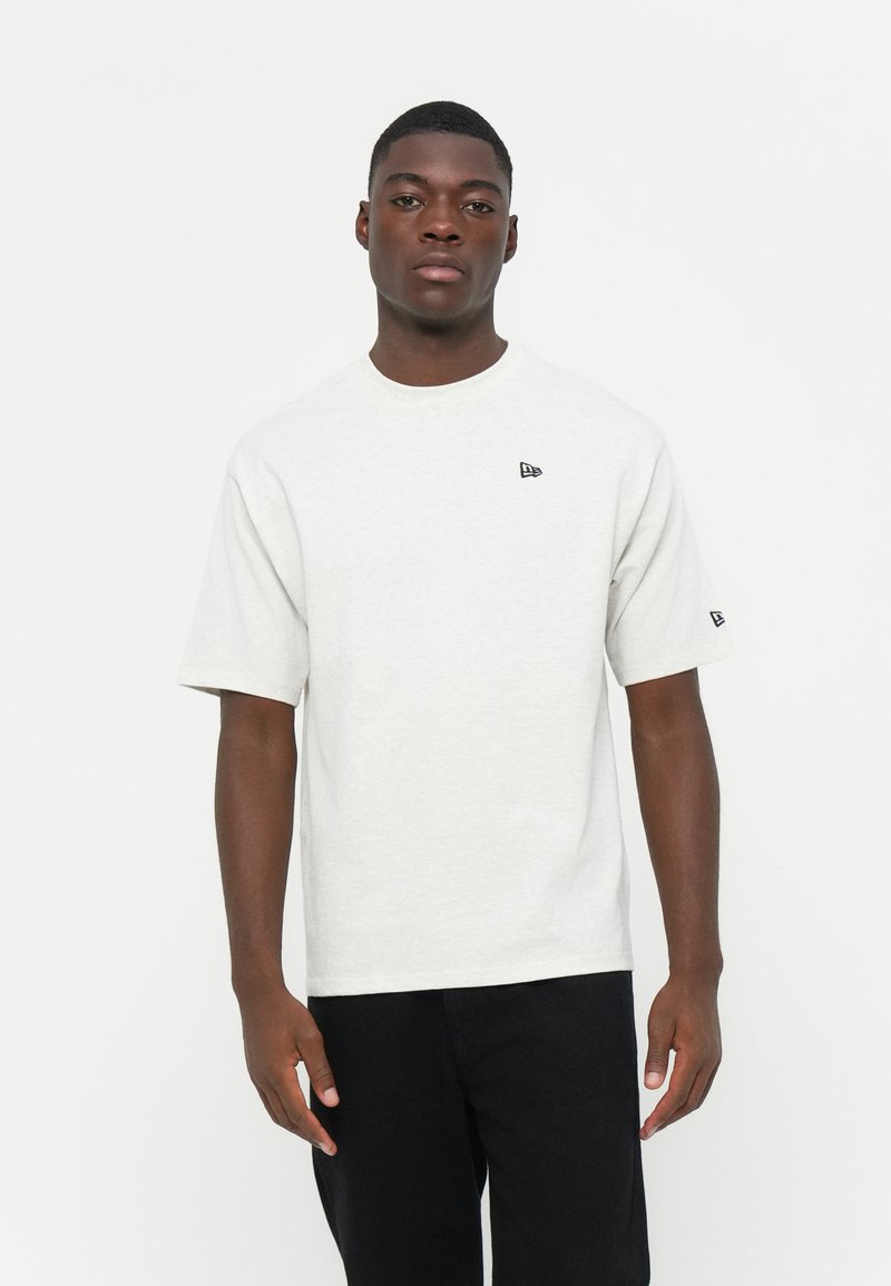 Light gray short-sleeve t-shirt made from cotton, featuring a round neckline and a small black logo on the left chest area.