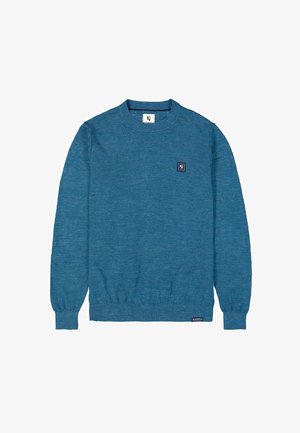 Blauwe lange mouwen crewneck trui met geribde manchetten en onderzijde, kleine vierkante logopatch op de borst en merklabel nabij de onderkant.