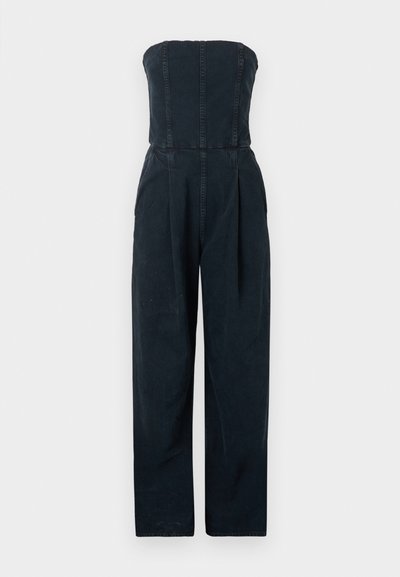 Black strapless jumpsuit with a fitted bodice and wide-leg trousers. Made of denim with visible seams and a clean, minimalist design.