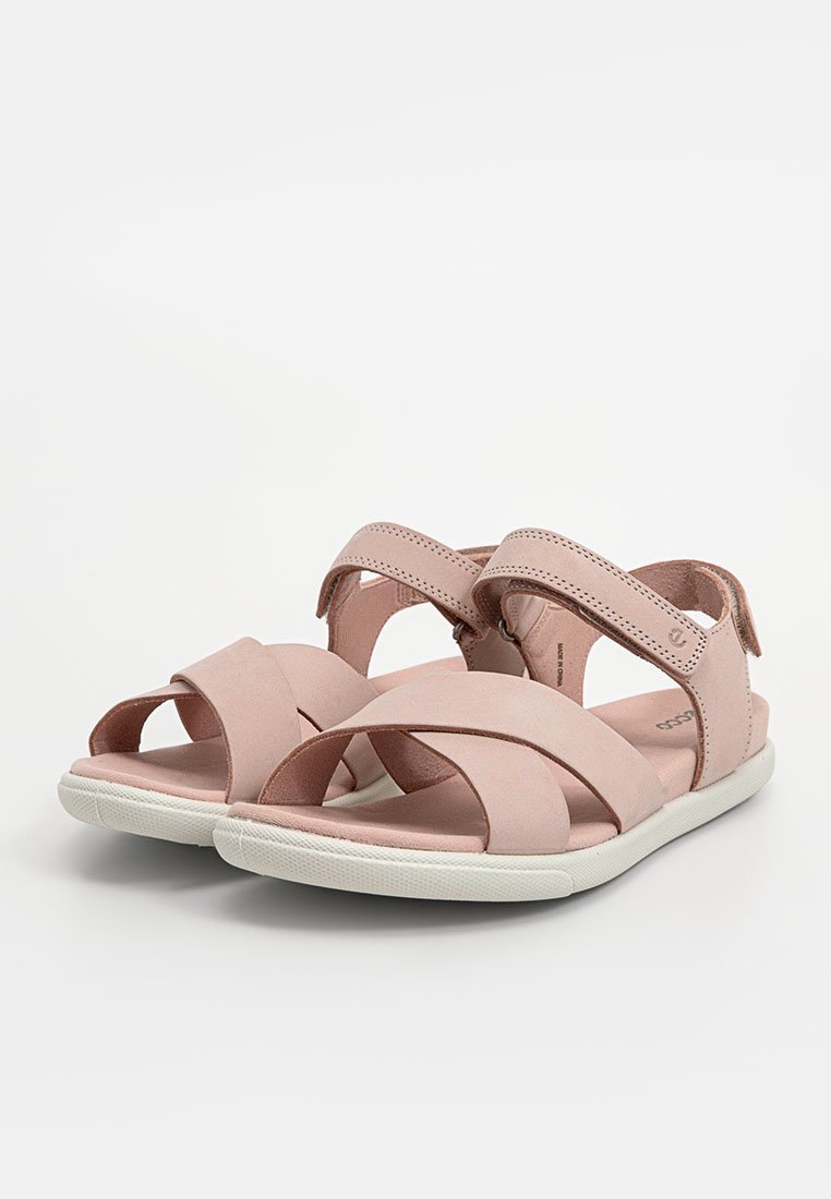 Rosa Leder-Sandalen mit geschlossenen Riemen im Kreuzdesign, verstellbarem Klettverschluss und einer weißen Gummisohle. Flaches und offene Zehen-Modell.