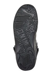 Schwarze Sportsohle mit strukturiertem Gummi, komplexen Mustern und erhöhten Akzenten für verbesserten Grip und Traktion.