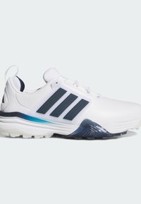 Λευκό αθλητικό παπούτσι με υφασμένο επάνω μέρος, λεπτομέρειες σε ναυτικό μπλε, λογότυπο με τρεις ρίγες, μπλε διαβαθμισμένη ενδιάμεση σόλα και ανθεκτική, διαμορφωμένη εξωτερική σόλα.