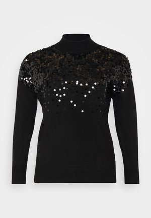 Svart tröja med hög halsringning och långa ärmar; dekorerad med svarta och silverfärgade paljetter på den övre delen för extra textur.