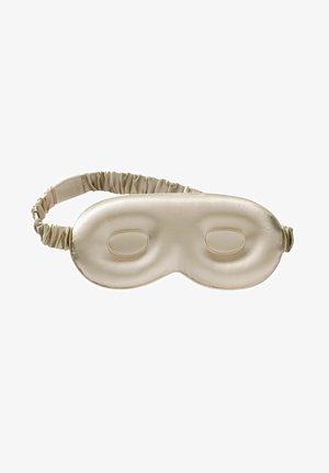 Beige satijnen slaapmasker met contoureerde oogzones, elastische band en een soepele textuur. Ontworpen om licht te blokkeren en comfort te bieden.