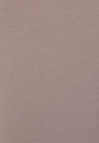 Light pink knitted fabric with a smooth texture and a consistent ribbed pattern throughout. No visible embellishments or details.