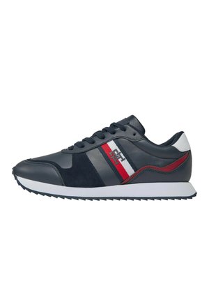 Scarpe sportive in pelle blu navy con dettagli in suede. Presentano una linea decorativa rossa e bianca, lacci rotondi e una suola in gomma con un motivo di trazione.