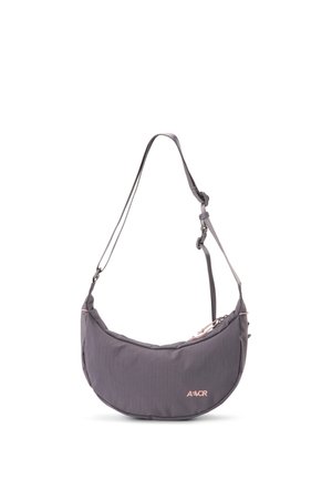Dark gray crescent-shaped shoulder bag with adjustable strap and small logo on front on a white background.