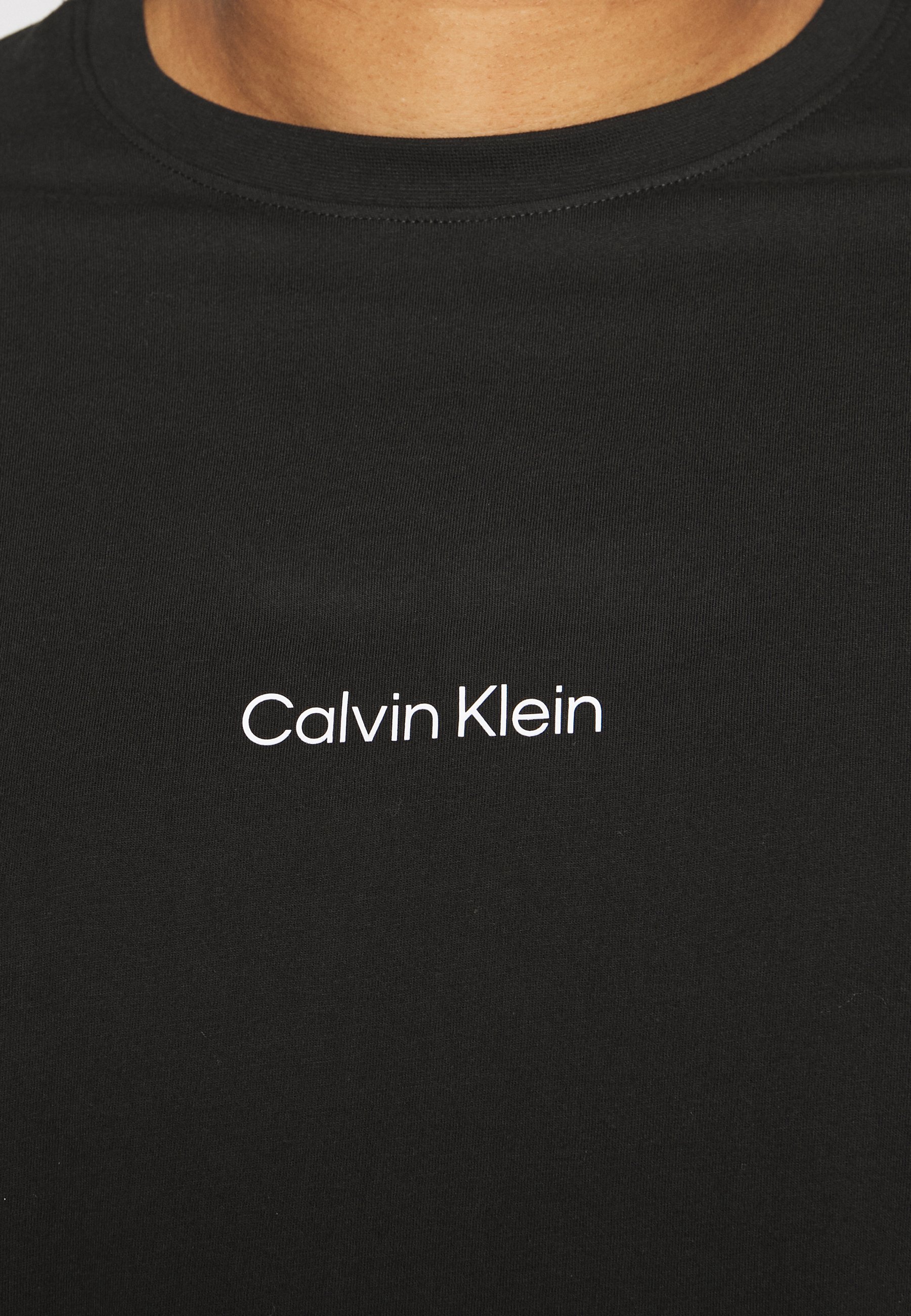 Calvin Klein THUNDER LOGO BACK - Print T-shirt - black - Zalando.co.uk Calvin Klein THUNDER LOGO BACK - Print T-shirt - black - Zalando.co.uk