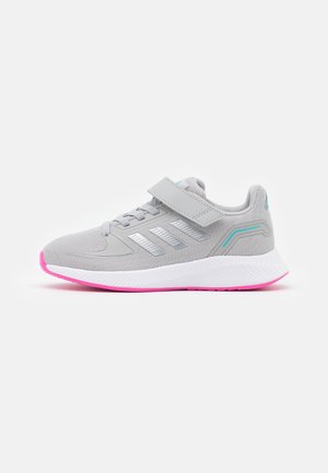 Grijze sport sneaker met roze zool, klittenbandsluiting en turquoise accenten, ontworpen voor comfort en casual gebruik.