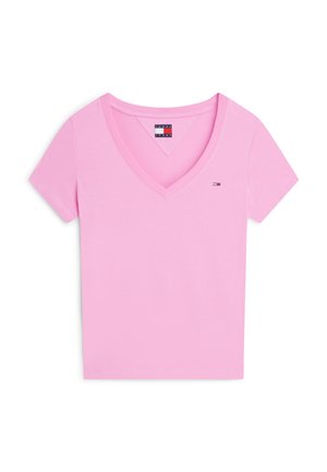 Ružové tričko s krátkym rukávom a výstrihom do V s malým logom Tommy Jeans na ľavej strane hrudníka a značkovou štítkom vo vnútri goliera.