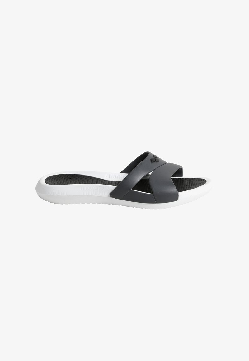 Black and white slide sandal featuring a cross-strap design, textured footbed, and a rubber sole for traction. Smooth finish and flexible material.