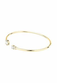 Bracciale a maniche in tono oro con due pietre rotonde e trasparenti a ciascun estremo. Superficie liscia e lucidata con un design minimalista.