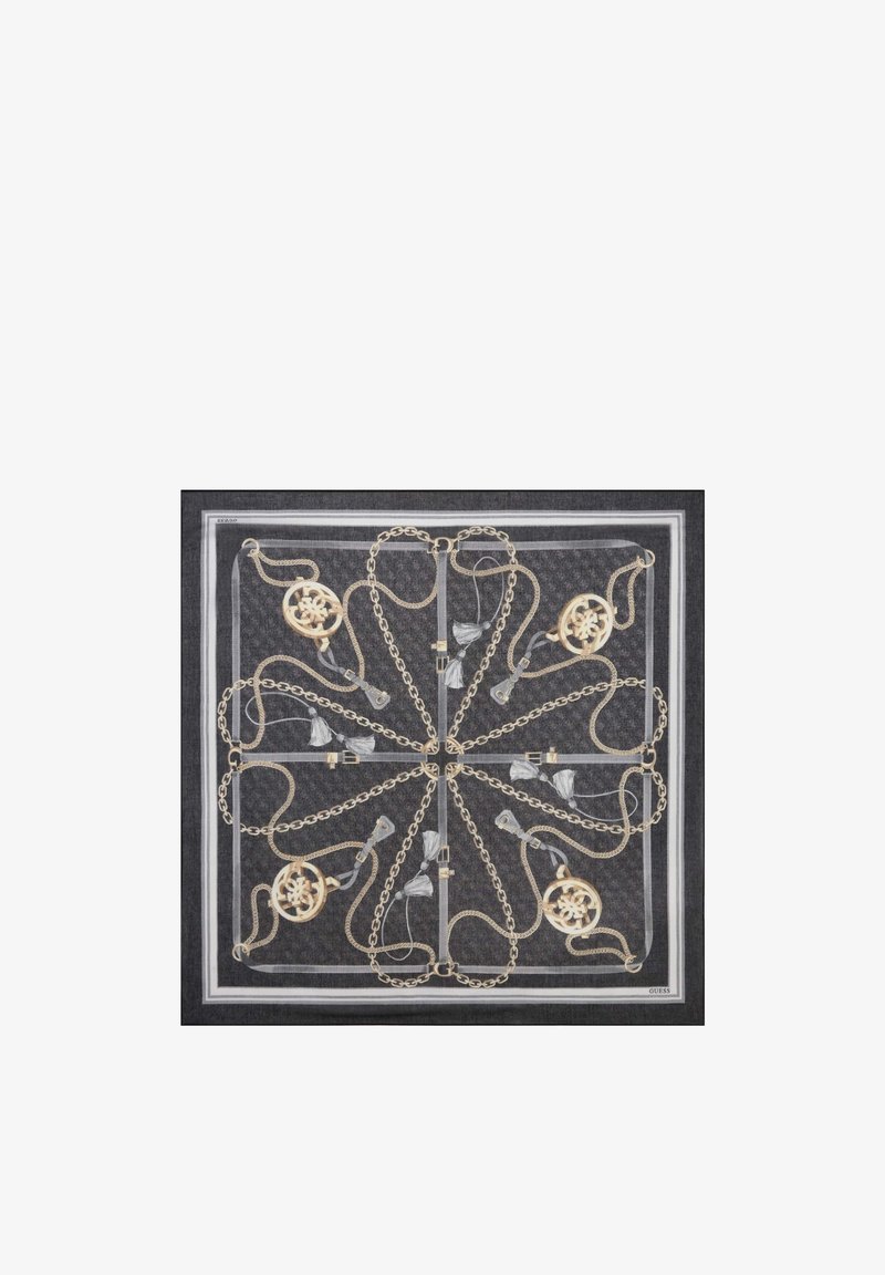 Foulard carré noir avec chaînes dorées symétriques, franges blanches et médaillons circulaires formant un motif radial, logo « Guess » dans un coin.