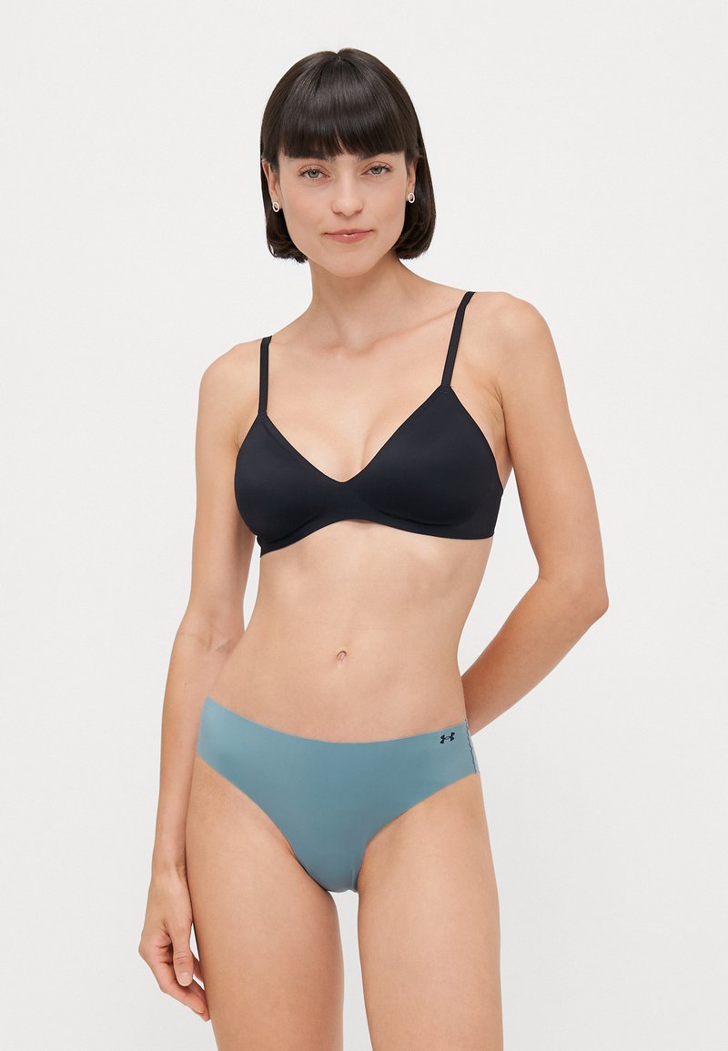 Black soft-cup bra featuring adjustable straps. Paired with light blue seamless bikini bottoms with subtle branding on the side.