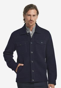 Marinblått ullblandat jacka med två bröstfickor, knappfront och en grå krage. Har en strukturerad design och texturerad tyg.