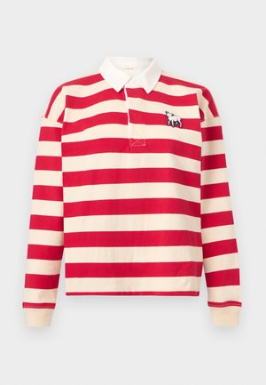 Chemise de rugby à manches longues avec des rayures horizontales rouges et crème, col blanc, et petit logo brodé de mouton sur la poitrine.