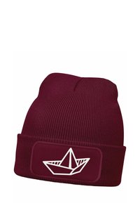 Maroon knit beanie with a ribbed texture and a fold-over cuff. Features a white graphic of a paper boat on a rectangular patch.