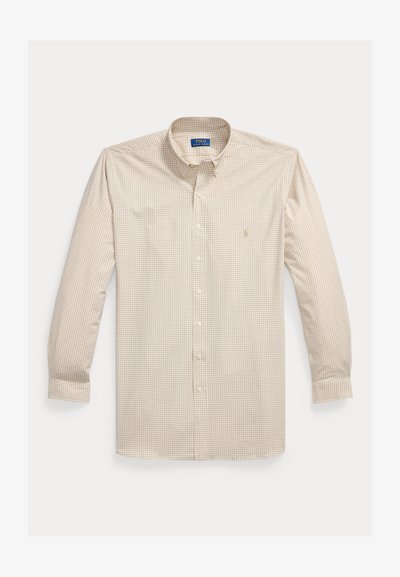 Chemise à carreaux beige et blanche à manches longues, boutonnée avec col, poignets et logo brodé sur la poitrine gauche.