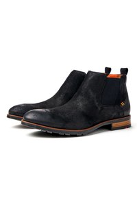 Bottines Chelsea en cuir suédé noir avec des panneaux latéraux élastiques, bout rond et semelle en caoutchouc. Présente un intérieur orange et un accent de talon rayé marron.