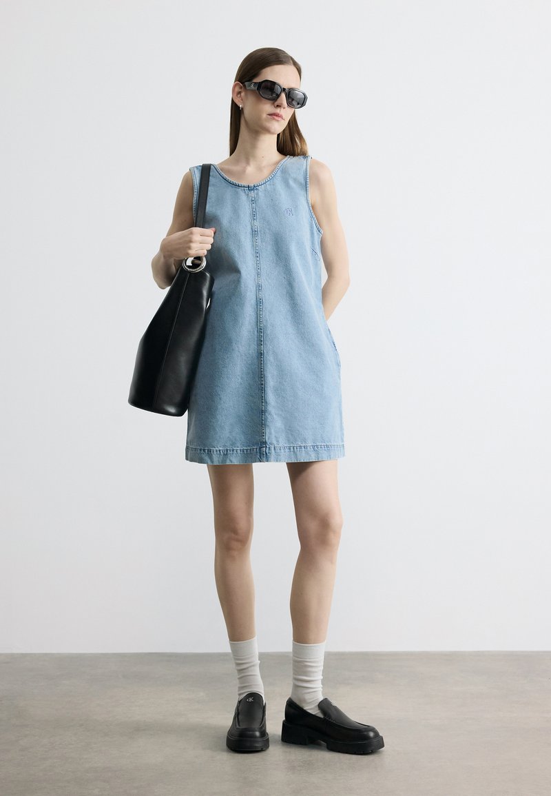 denim dress with front pockets Chic Plus Size Sleeveless Button for Ca – Canary Houze Cowboy Boots At Weddings pleated-dress Primary color:Light blue cotton Model is 5 9