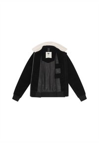 Zwarte corduroy jas met een crèmekleurige faux fur kraag. Binnenkant heeft een gladde zwarte voering en één zak. Geribde manchetten en zoom.