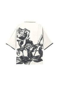 Chemise blanche à manches courtes avec un motif graphique vertical noir de grandes roses et feuilles couvrant le dos.
