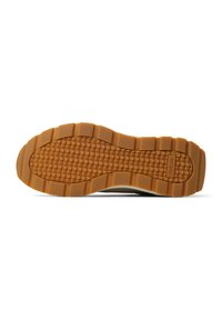 Semelle de chaussure en caoutchouc avec un motif texturé en nid d'abeille de couleur beige. Présente des rainures marquées pour l'adhérence et le nom de la marque embossé sur le côté.