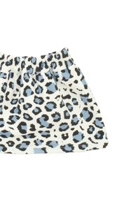 Gonna a fantasia leopardata bianca, con macchie nere e azzurre chiare. Vita elastica e design plissettato per un fit rilassato. Tessuto di cotone.
