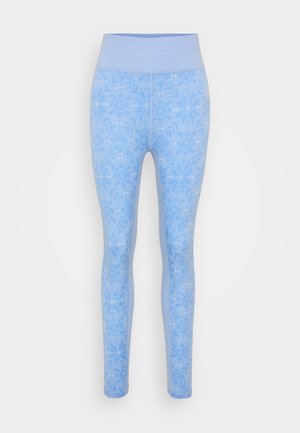 Las mallas azules presentan un diseño estampado con motivos de copos de nieve. Fabricadas con un material suave, tienen una cintura alta y elástica.